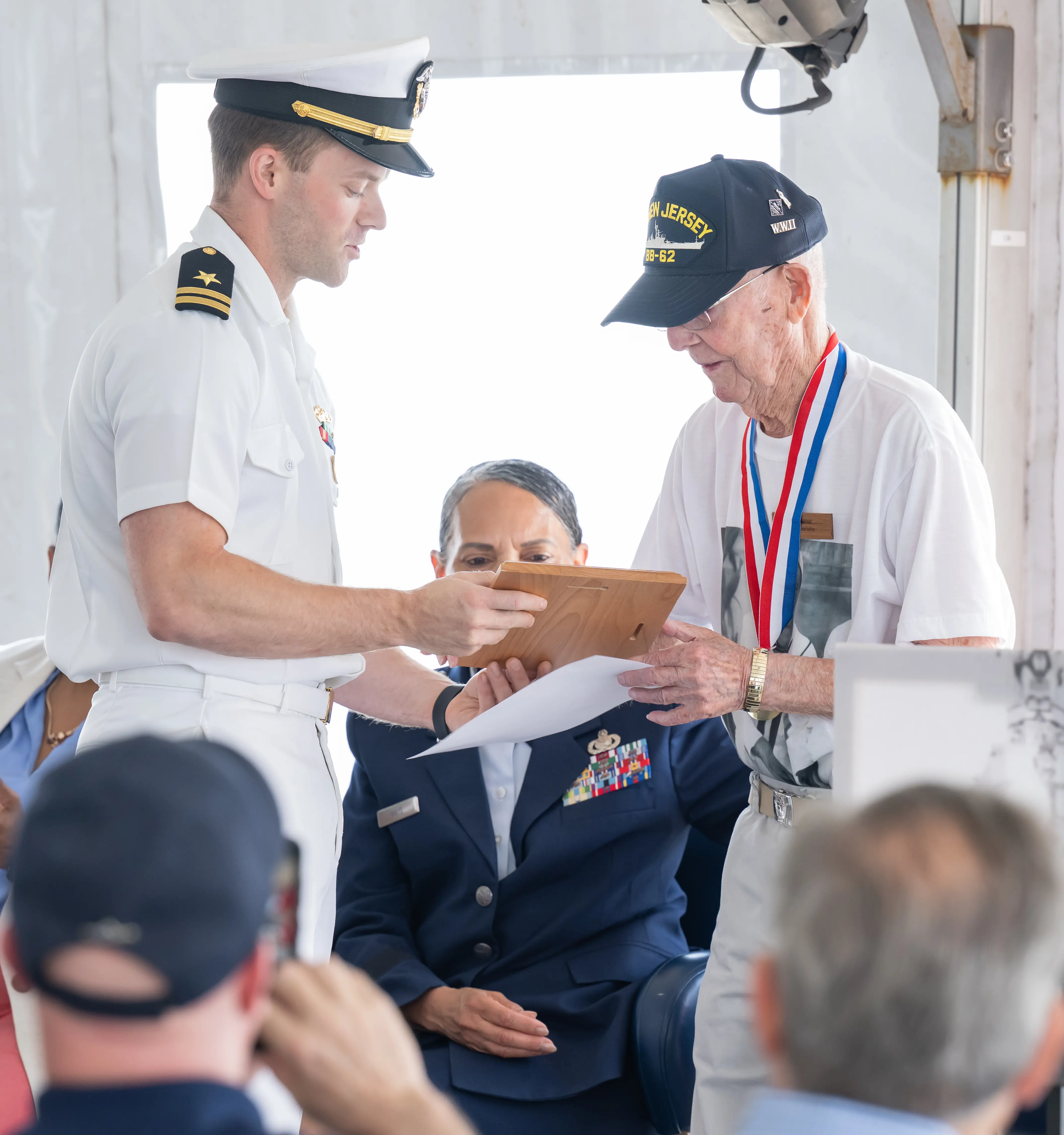 Paul Robbins with attendees during the June 15 ceremony aboard Battleship New Jersey.